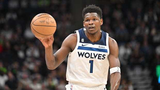 Minnesota Timberwolves guard Anthony Edwards dribbles the basketball during a game.